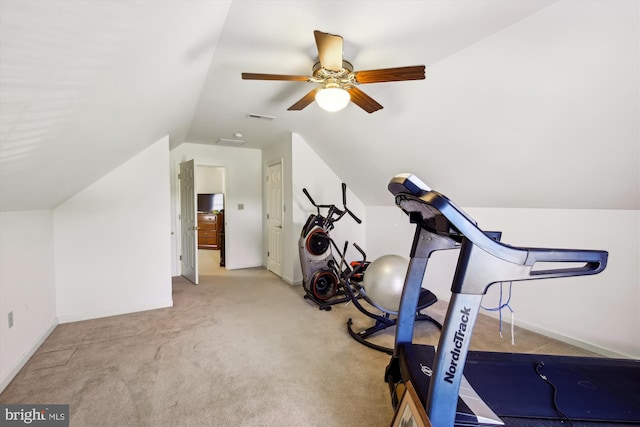 exercise room with lofted ceiling, light colored carpet, and ceiling fan