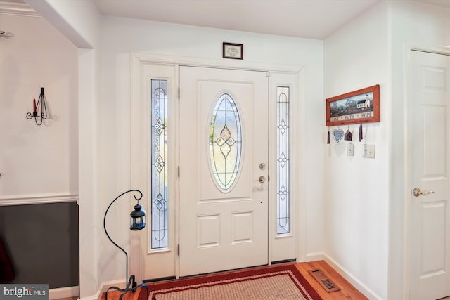 entrance foyer featuring hardwood / wood-style floors