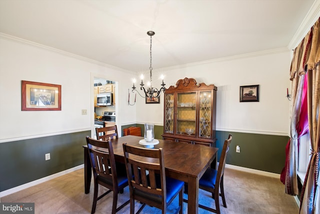 dining area featuring a notable chandelier, crown molding, and carpet flooring