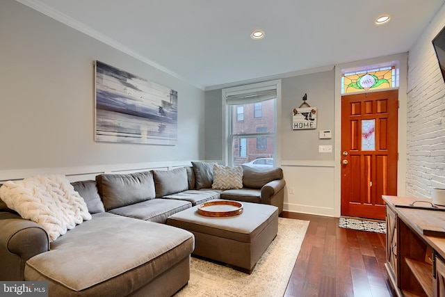 living room with crown molding and dark hardwood / wood-style floors