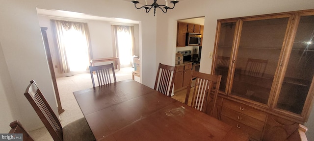 unfurnished dining area with an inviting chandelier