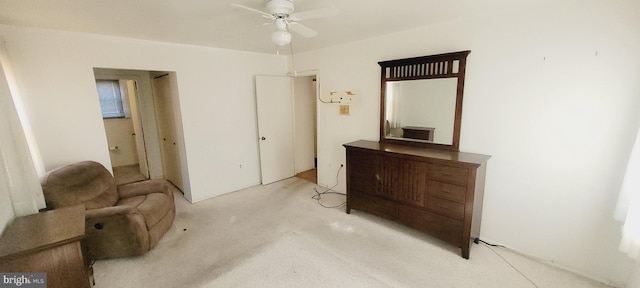 living area with carpet floors and a ceiling fan