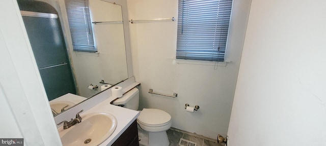 bathroom featuring visible vents, vanity, and toilet