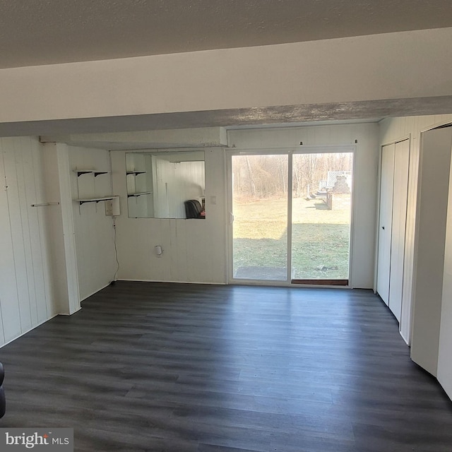 empty room featuring dark wood-style floors