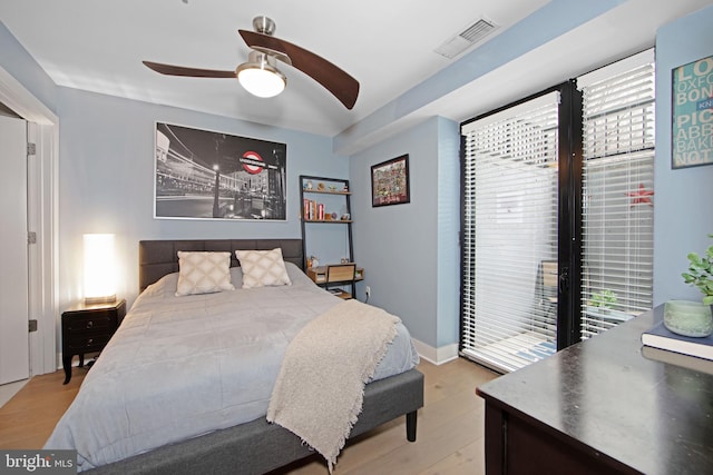 bedroom with ceiling fan and light hardwood / wood-style flooring