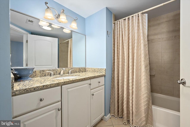 bathroom with vanity, tile patterned floors, and shower / tub combo with curtain