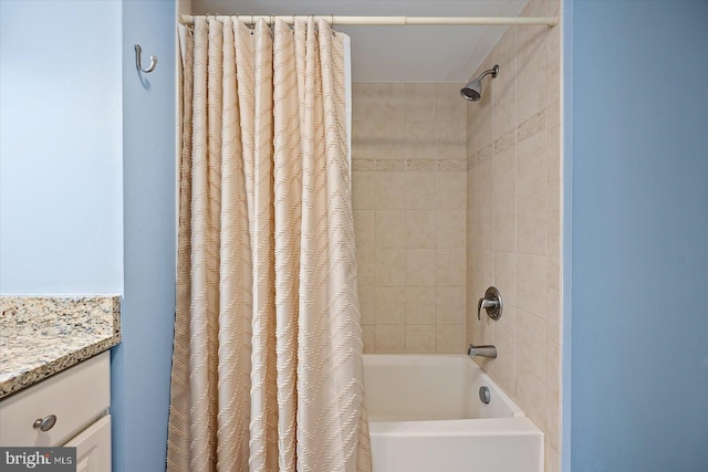 bathroom with vanity and shower / tub combo with curtain