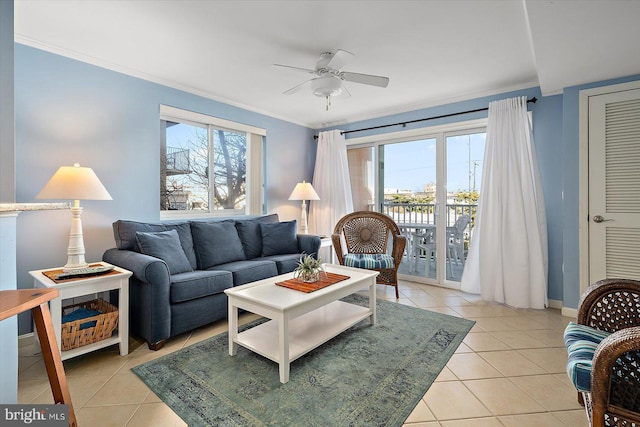 tiled living room featuring crown molding and ceiling fan