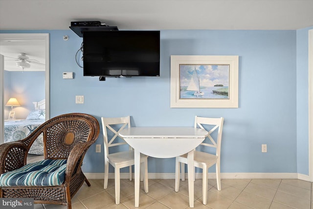 dining room featuring ceiling fan and light tile patterned floors