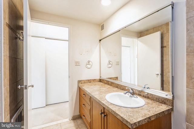 bathroom with vanity and tile patterned flooring