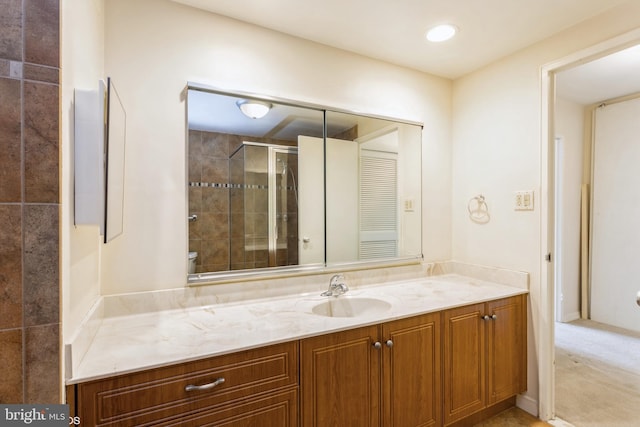 bathroom with vanity and an enclosed shower