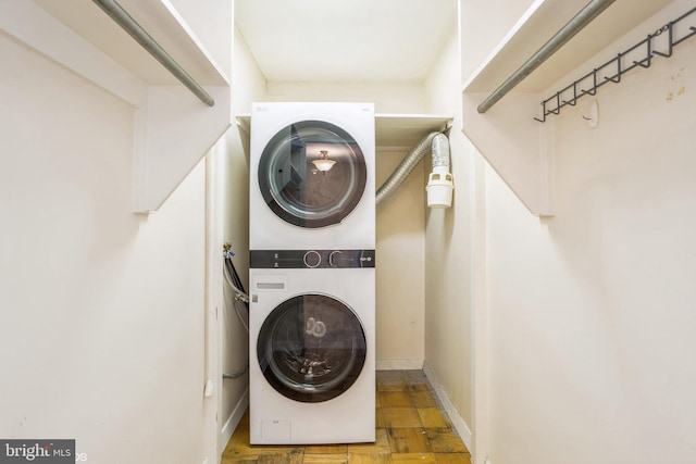 laundry area with stacked washer / drying machine