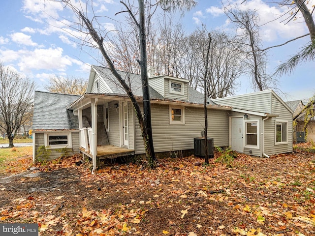 rear view of property with central AC and covered porch