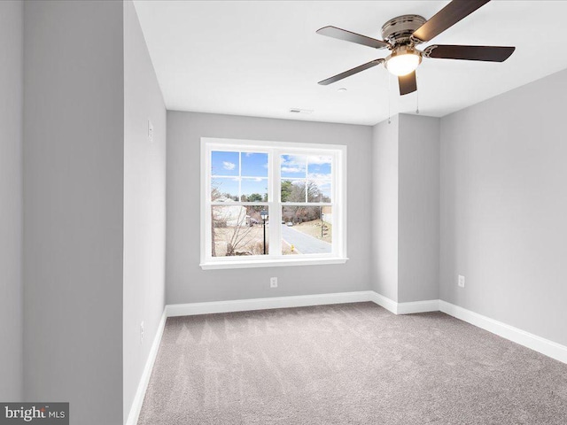 carpeted empty room with ceiling fan