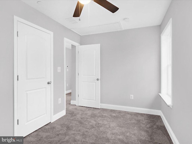 unfurnished bedroom with light colored carpet and ceiling fan