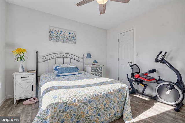 bedroom featuring hardwood / wood-style floors and ceiling fan