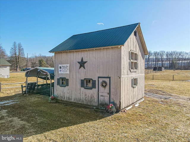 view of outdoor structure with a lawn