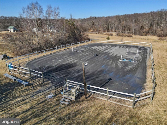 birds eye view of property with a rural view