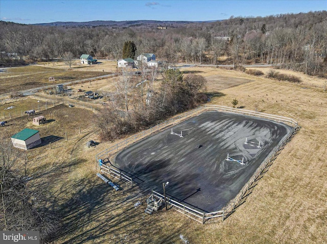 birds eye view of property with a rural view