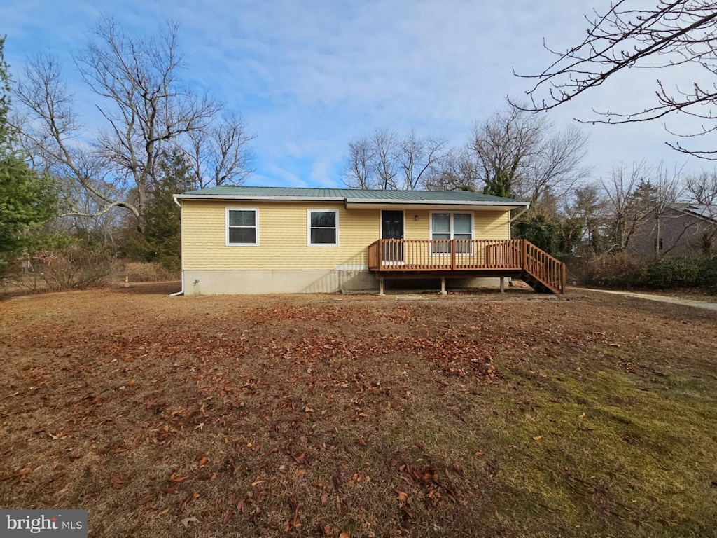 view of front of home with a wooden deck