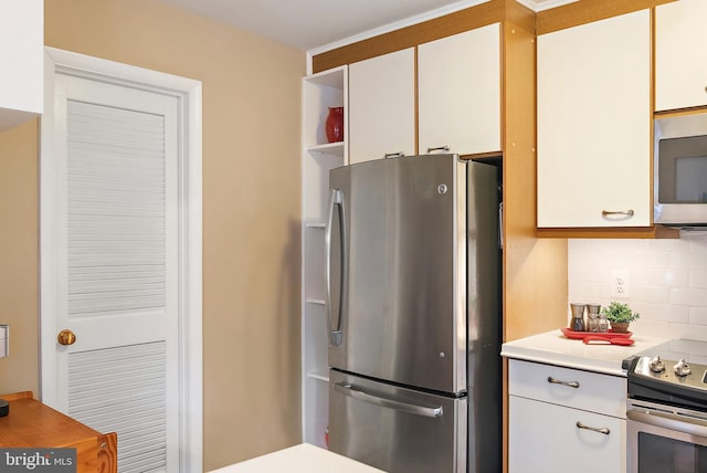 kitchen featuring white cabinetry, light countertops, appliances with stainless steel finishes, backsplash, and open shelves