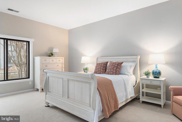 bedroom featuring light carpet, baseboards, and visible vents