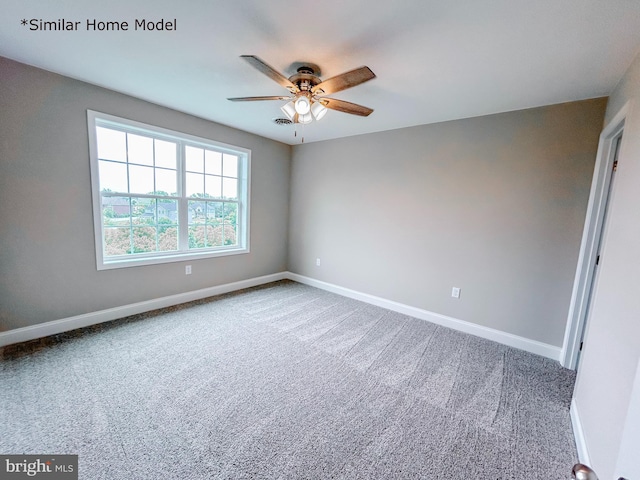 carpeted empty room with ceiling fan