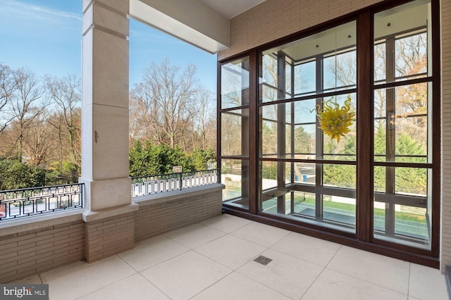 unfurnished sunroom with a wealth of natural light