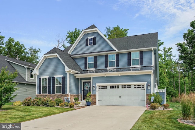 craftsman-style home with a garage and a front lawn