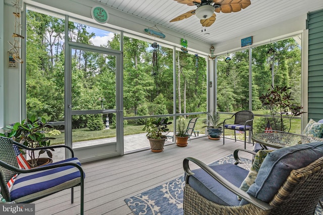 sunroom / solarium with ceiling fan