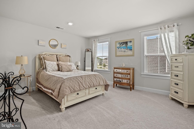 bedroom featuring light colored carpet