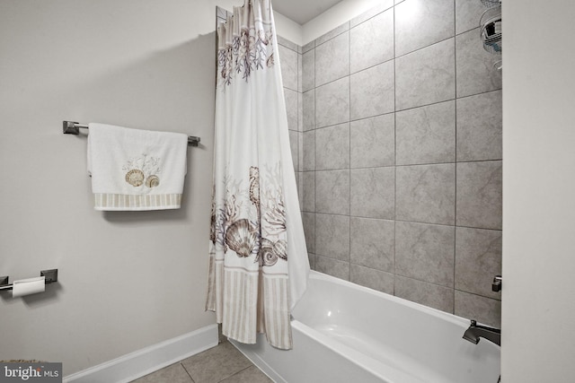 bathroom featuring shower / bathtub combination with curtain and tile patterned flooring