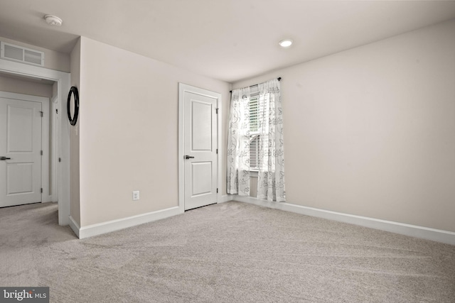 unfurnished bedroom featuring light colored carpet