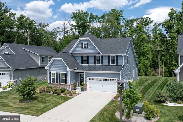 view of front of home featuring a garage and a front yard