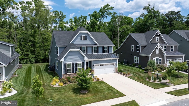 craftsman inspired home with a garage, a front yard, and central air condition unit