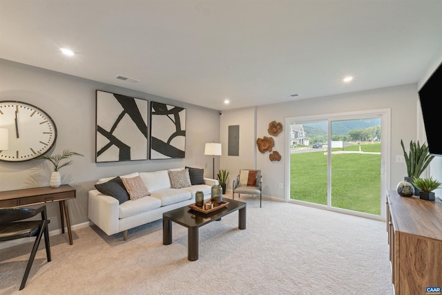 carpeted living room with electric panel