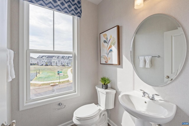 bathroom featuring sink and toilet