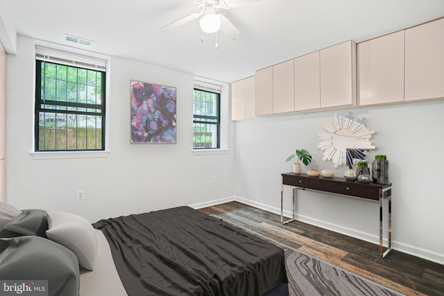 bedroom featuring dark hardwood / wood-style floors and ceiling fan