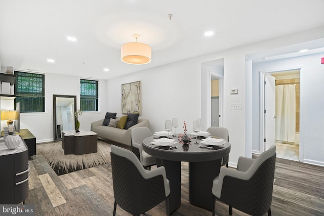 dining space featuring dark hardwood / wood-style flooring