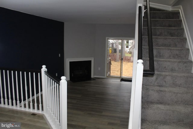 staircase featuring hardwood / wood-style floors