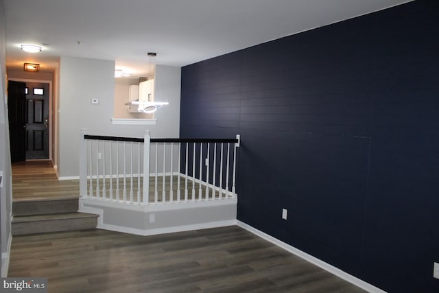 stairway with wood-type flooring