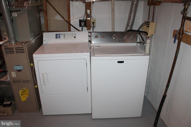 laundry room featuring separate washer and dryer