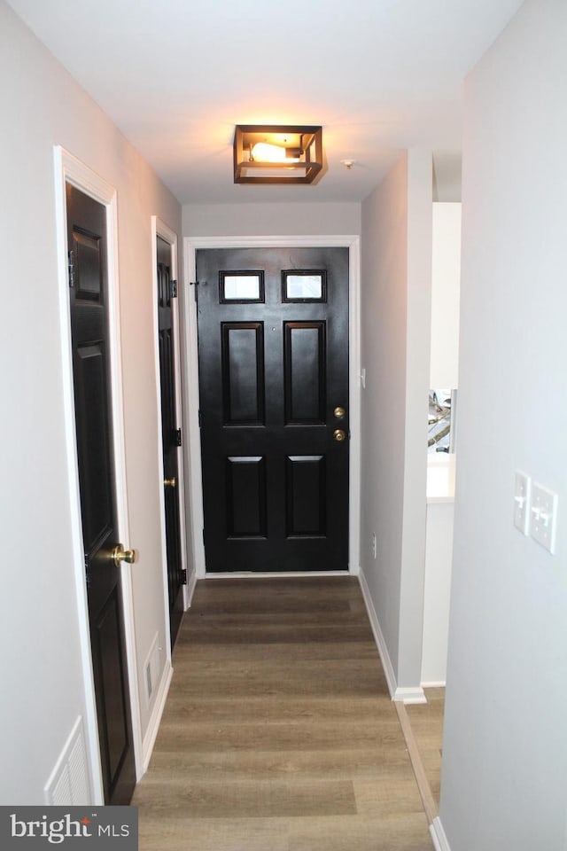 doorway to outside featuring hardwood / wood-style flooring