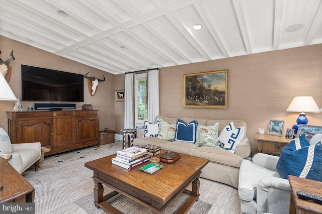 living room with beam ceiling