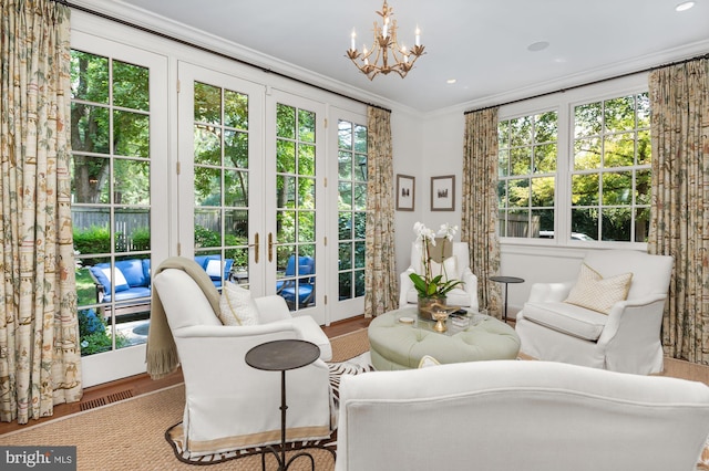 sunroom featuring a notable chandelier