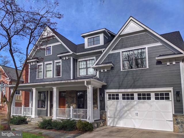 craftsman house featuring a garage and covered porch