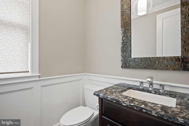 bathroom featuring vanity and toilet