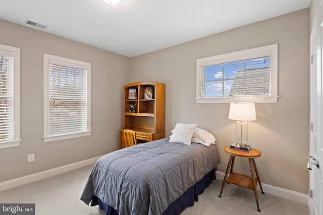 bedroom with light carpet