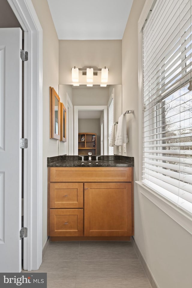 bathroom featuring vanity and a wealth of natural light