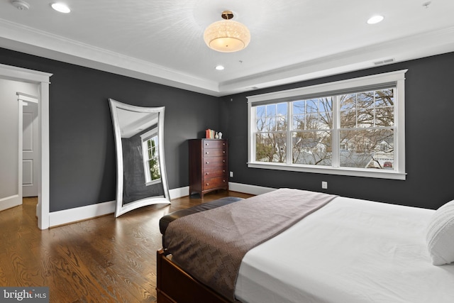 bedroom featuring ornamental molding and dark hardwood / wood-style floors